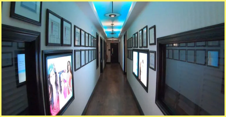 Hallway lined with before and after images